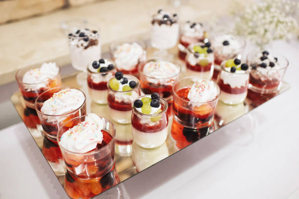 istock Desserts in jars with a creative presentation. Jelly with whipped cream and fruit served in an elegant way. 2182461776