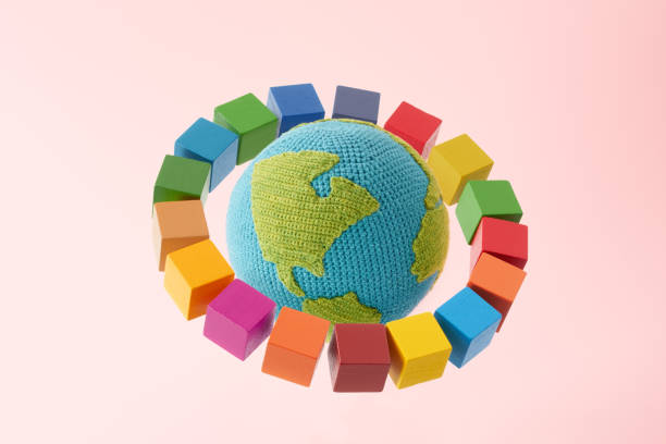 istock SDGs symbols and a wooden cube with knitted earth 2182466107