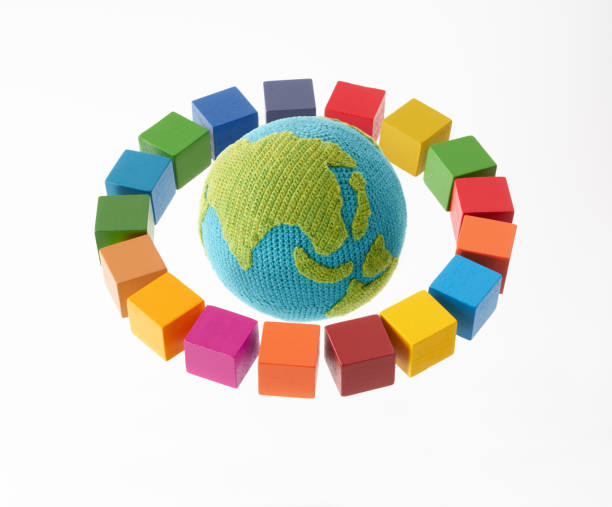 istock SDGs symbols and a wooden cube with knitted earth 2182466156