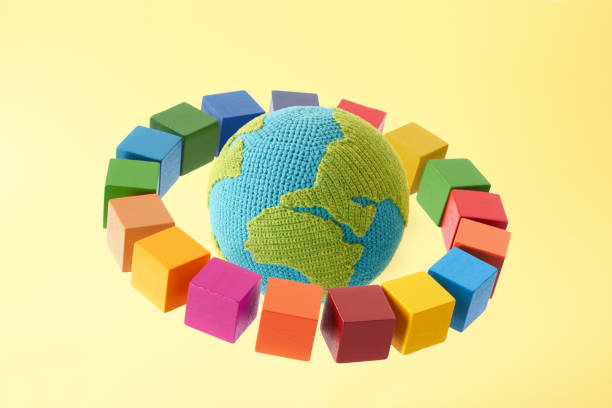 istock SDGs symbols and a wooden cube with knitted earth 2182466209
