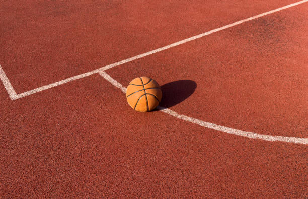istock Basketball ball on a public playing court 2182468546