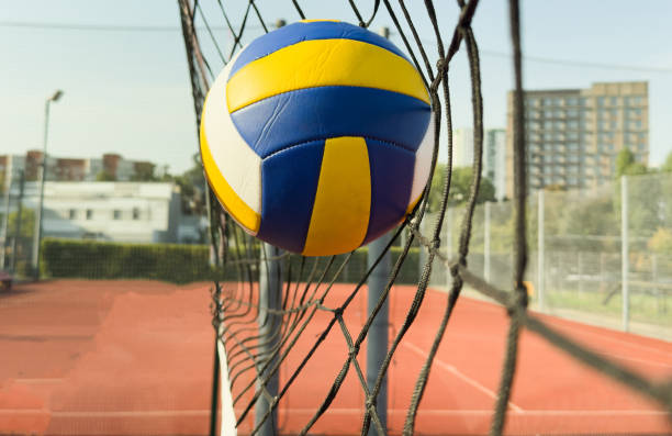 istock Volleyball action. Ball above net during volleyball game. 2182468774