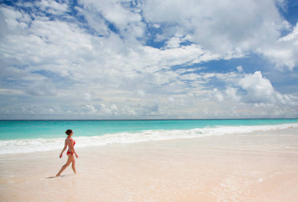 istock Barbados, young woman on caribbean beach. 2182471165