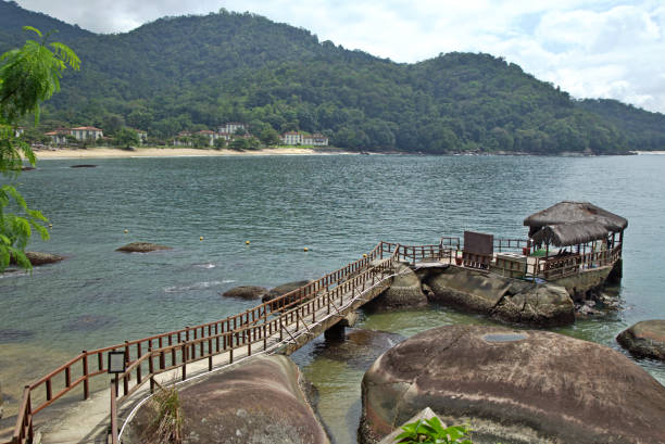 istock Sea with pathway to reach rocky island 2182471293