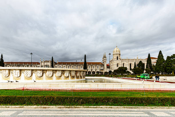 Lisbon, Portugal - December 15, 2018: Jerónimos Monastery, located in Lisbon’s historic Belém district, is one of Portugal's most revered landmarks and a symbol of the Age of Discovery. This grand structure, built in the early 16th century in the Manueline architectural style, is renowned for its elaborate carvings, maritime motifs, and stunning cloisters.