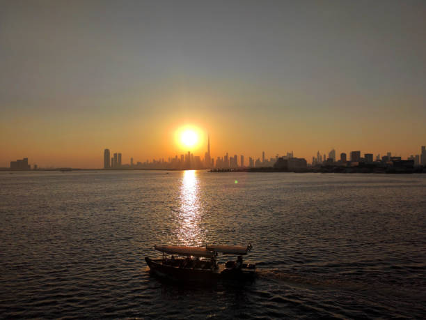 Dubai, UAE - October 13, 2024: Iconic city skyline with Burj Khalifa seen from the Dubai Creek Harbour at sunset
