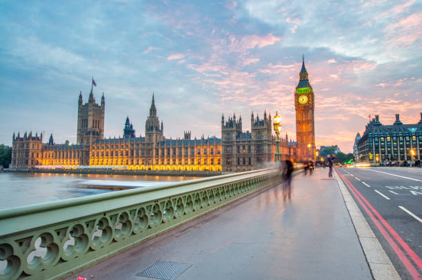 istock Westminster bridge at night in London 2182480591
