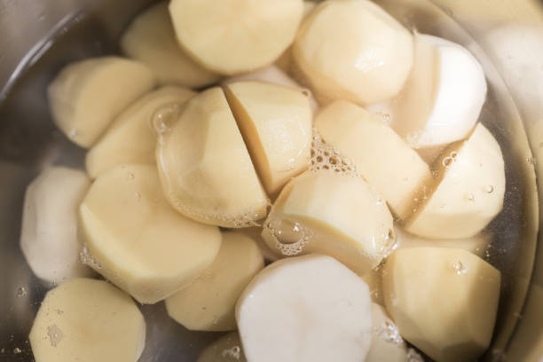 istock sliced potatoes in water 2182485817