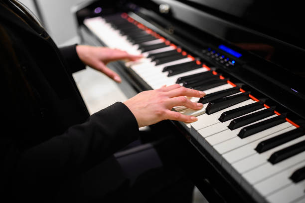 istock Musician playing a digital piano keyboard with skill and precision 2182486081