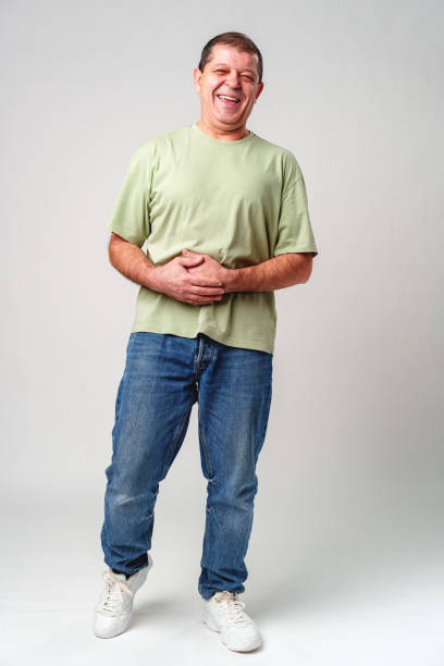 istock Smiling older man with a warm expression against a neutral background, showcasing happiness and joy 2182486826