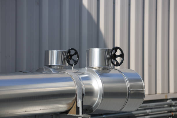 Pipe jacket aluminum work point where the  handwheel operated valve protrudes. Insulation work for cold water pipes to prevent condensation.