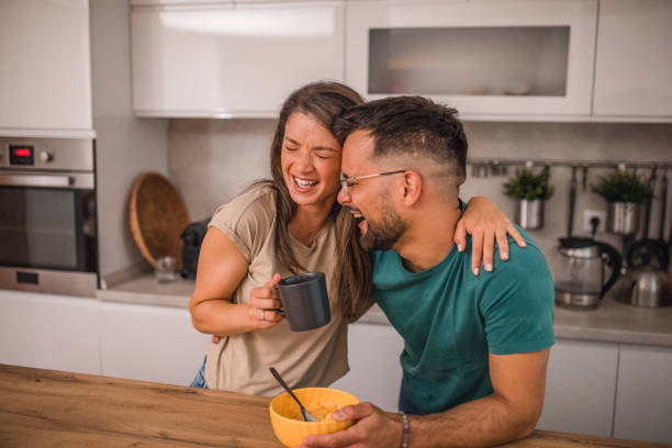 istock A loving couple hugs each other during breakfast in the kitchen 2182488930