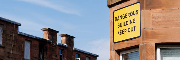 istock Dangerous building keep out sign on building ready to be demolished 2182490804
