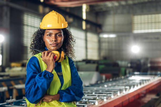 istock Foreman or worker work at factory site check up machine or products in site. 2182492933
