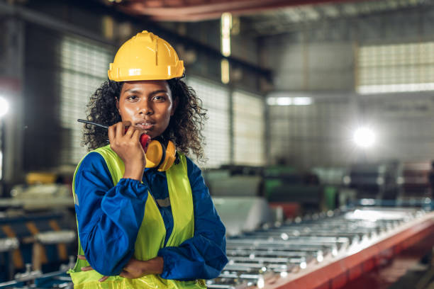 istock Foreman or worker work at factory site check up machine or products in site. 2182492941