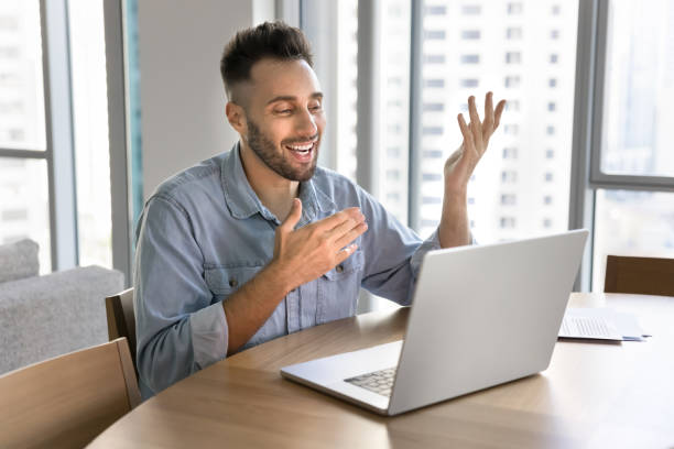 istock Happy Latin vlogger man broadcasting online on social media 2182498345