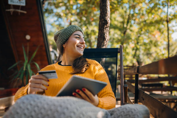 istock Online shopping in front of my log cabin 2182503073