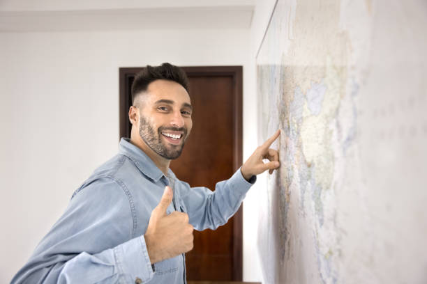 istock Cheerful Latin man showing like thumb up hand at camera 2182504233