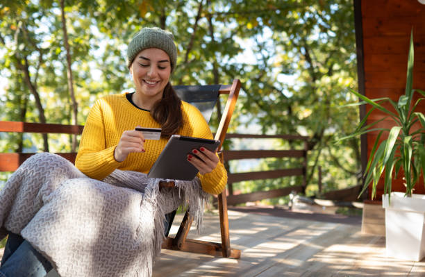istock Online shopping in front of my log cabin 2182504267