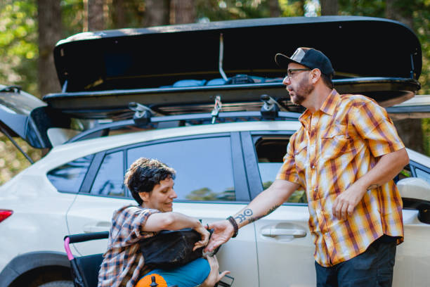 istock Diverse Adult Couple with Multiple Sclerosis Enjoying Camping 2182505450