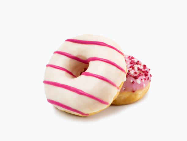 istock two donuts of white chocolate and pink stripes 2182507097