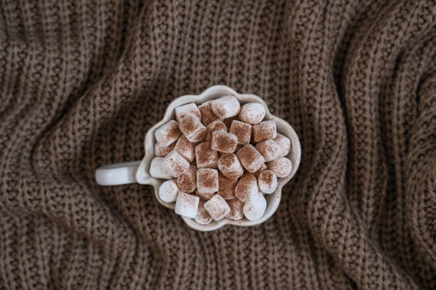 Close up of hot chocolate with whipped cream,marshmallows and sprinkles
