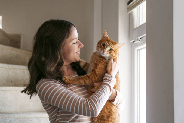 istock Young woman and her red cat 2182508965