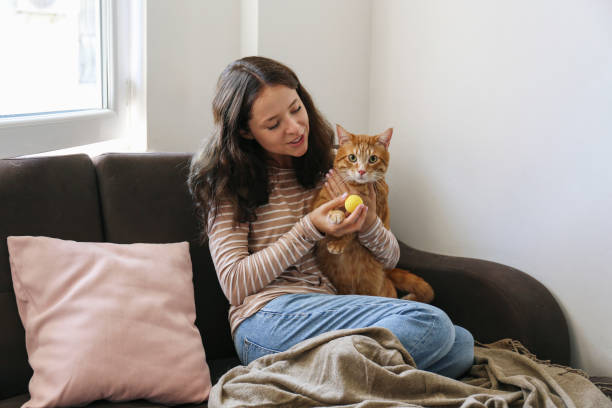 istock Young woman and her red cat 2182508987