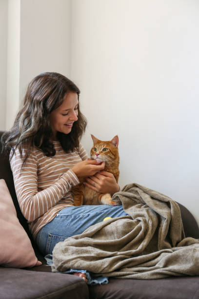 istock Young woman and her red cat 2182509013