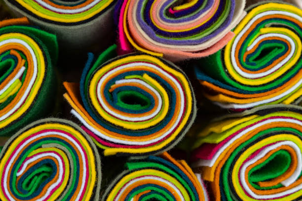 abstract colorful rolls of fabric seen from above