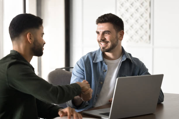 istock Positive young Arabic business partners starting collaboration 2182516283