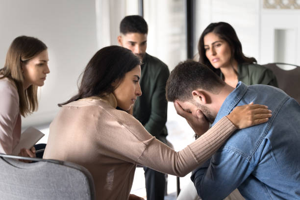 istock Latin counsellor giving support to tired depressed patient 2182518664