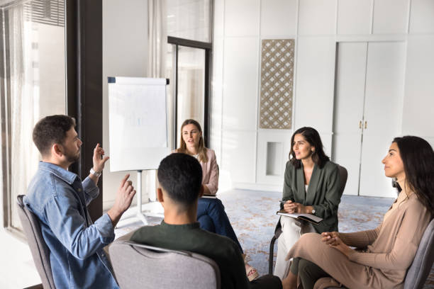 istock Multiethnic business team sitting in circle in office 2182518844