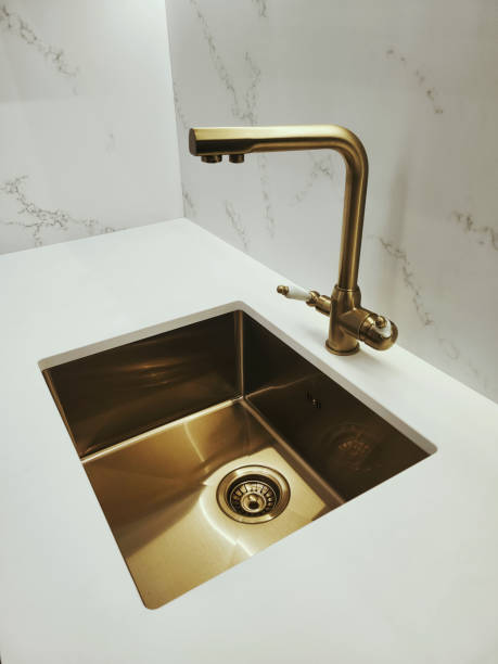 istock Bronze ball mixer with ceramic handle and bronze sink with drain 2182524625