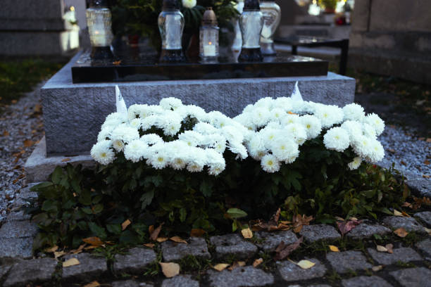 istock Decorated graves at a cemetery on All Saints Day (Wszystkich Swietych) in Poland. 2182527566