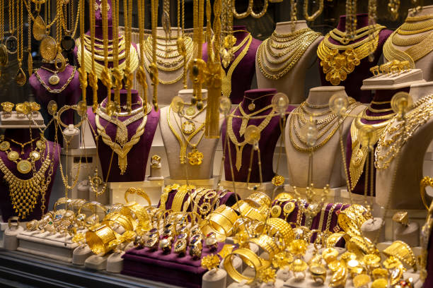 istock Gold jewelry display from jewelry store window. 2182535517