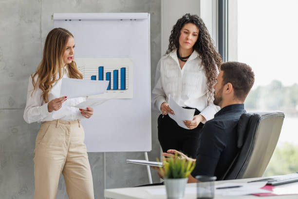 istock Team Discussion with Presentation and Business Chart 2182537229