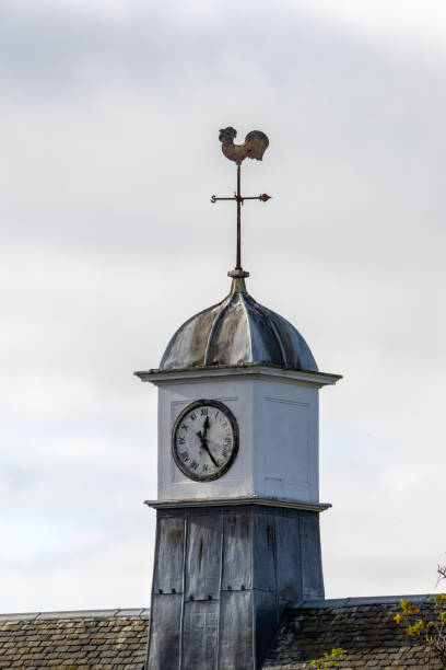 istock A clock tower with a weather vane on top, Edinburgh Balerno 2182537367