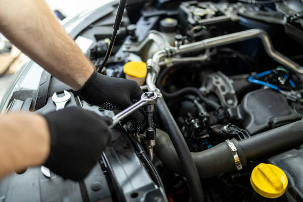 istock Mechanic working on an engine with tools in a workshop during daytime, focusing on maintenance and repairs 2182541120