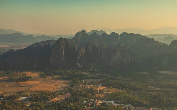 istock Stunning scenery of rainforest-covered karst mountains at sunset, including Pha Boua peak and Pha Kongkhao, near Vang Vieng, Laos 2182542139