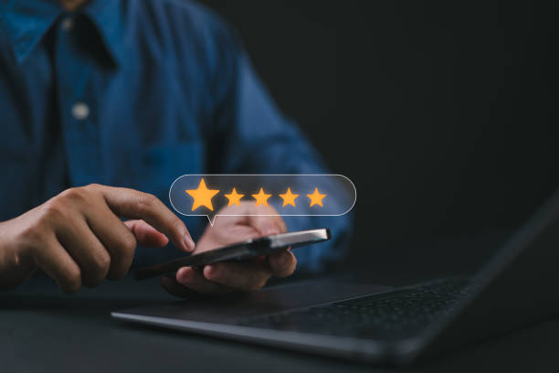 istock User take survey feedback online on application smartphone. Rate experience satisfaction for 5 stars, Best review and rating to review service. Customer satisfaction concept. 2182542310