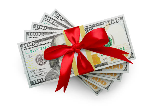 istock Fifty Thousand Dollars Stack of One Hundred Dollar Bills Wrapped in a Red Bow Isolated on a White Background. 2182543864