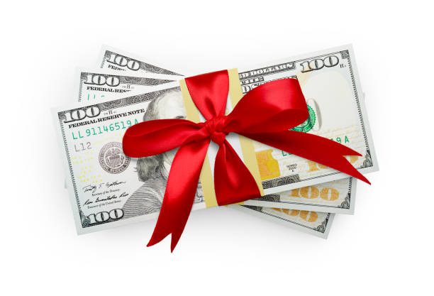 istock Thirty Thousand Dollars Stack of One Hundred Dollar Bills Wrapped in a Red Bow Isolated on a White Background. 2182543868
