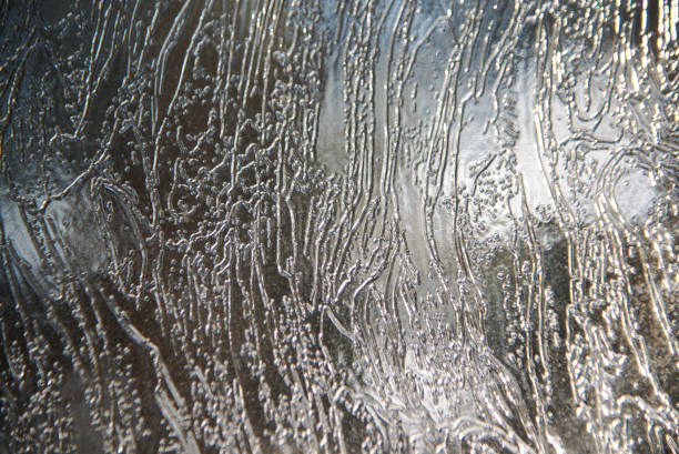 Frozen window glass during winter day