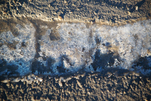 Snow that is hard and embedded in concrete in winter.