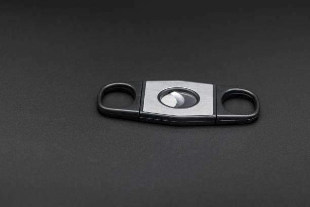 istock Stainless steel cigar cutter on dark background 2182545698