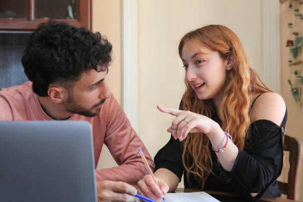 istock international young couple studying at home 2182547480