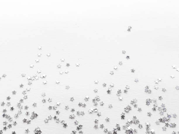 istock Silver star confetti on white background. Minimalist festive decoration 2182548659