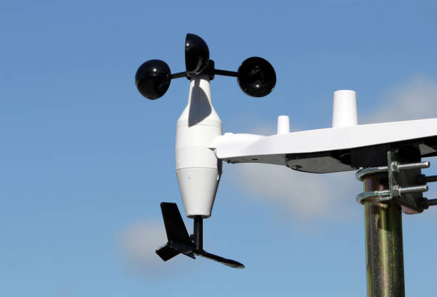 istock Wind vane on a weather station mounted on a pole against a blue sky 2182553047