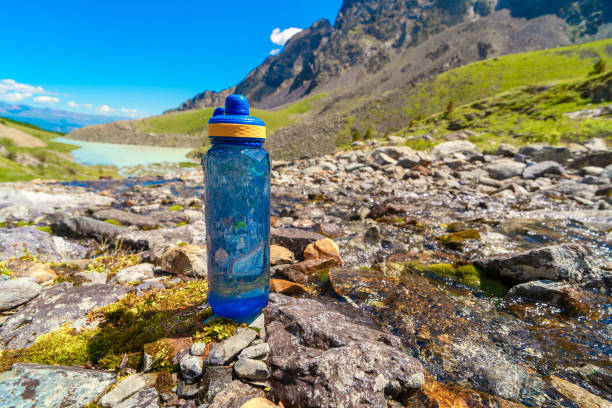 istock bottle of water in the mountains 2182555617